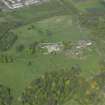 Oblique aerial view centred on the remains of the castle, taken from the SW.