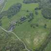 Oblique aerial view centred on the remains of the castle, taken from the NE.