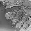 RMS Queen Elizabeth, under construction in John Brown's shipyard, Clydebank. Oblique aerial view of the liner, from S.