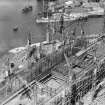 RMS Queen Elizabeth, under construction in John Brown's shipyard, Clydebank. Oblique aerial view of the liner, from E.