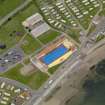 Stonehaven. Oblique aerial view centred on open air swimming pool with the Leisure Centre adjacent, taken from the S.