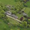 Oblique aerial view centred on the country house, taken from the SW.