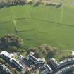 Oblique aerial view of the slight earthworks on the site of Clockmill House, Holyrood Park, taken from the N.