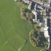 Oblique aerial view of the slight earthworks on the site of Clockmill House, Holyrood Park, taken from the SE.