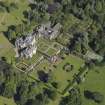 Oblique aerial view centred on the house with the gardens adjacent, taken from the SSW.