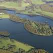 General oblique aerial view centred on the ruins and gardens of Castle Kennedy and Lochinch Castle, taken from the SW.