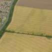 Oblique aerial view centred on the cropmarks of the settlement at Seton West Mains, taken from the SW.