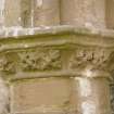 W end of chapter-house, pilaster on S wall, view of capital from NE
