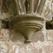 Chapter-house, W end, detail of corbel on S wall