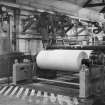 Copy of photograph of Reeler at Dry End of Paper Machine No. 4 (PM4) showing a belt drive section, undated