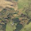 Oblique aerial view centred on the remains of the dun and Killellan Farm South, taken from the S.