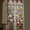 Interior. Detail of stained glass window to W of pulpit