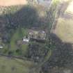Oblique aerial view centred on the country house with the stables adjacent, taken from the S.