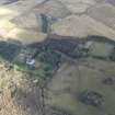 Oblique aerial view centred on the country house with the stables adjacent, taken from the SSE.