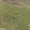 Oblique aerial view centred on the remains of Eynhallow monastery, taken from the SW.