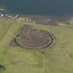 Oblique aerial view centred on the Ring of Brodgar with the cairns adjacent, taken from the SW.