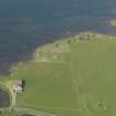 Oblique aerial view of the Stones of Stenness an the Barnhouse settlement, taken from the SW.