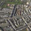 Oblique aerial view centred on part of Leith Walk, taken from the SE.