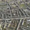 Oblique aerial view centred on part of Leith Walk, taken from the NW.