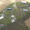 Oblique aerial view of East Fortune Airfield technical area, taken from the SW.