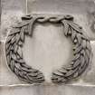 2nd stage of cella. Wreath relief. Detail