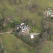 Oblique aerial view centred on the country house with the walled garden and stables adjacent, taken from the SSW.