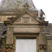Detail of dormer with carved thistle motif in the pediment and finial.