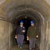Interior, within access tunnel, Mr Allan Kilpatrick (RCAHMS) and Mr Matt Ritchie (Forestry Commission) exitiing.