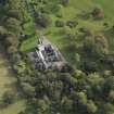 Oblique aerial view centred on the castle, taken from the NW.