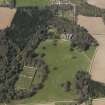 Oblique aerial view of the country house with the walled garden adjacent, taken from the SE.