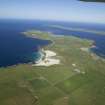 General oblique aerial view pf the N of Westray centred on Links of Noltland settlement, taken from the W.