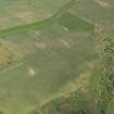 Oblique aerial view of the cropmarks of the settlement, taken from the SW.