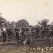 View of a group of men with bicycles and penny farthings from the Stanley Cycling Club.  

