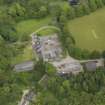 Oblique aerial view of Kinmount House stables, taken from the WSW.
