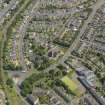 Oblique aerial view centred on the churches (old and new), taken from the SW.