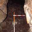 Trench 17 from N, surface of C17.06, within narrow section of Bone Passage (Scales = 2m & 0.5m)