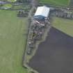 Oblique aerial view centred on the domestic site, taken from the
