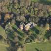 Oblique aerial view centred on the tower house/country house, taken from the SW.