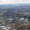 General oblique aerial view of Glasgow showing the route of the M74 extension going through the Polamadie area to the M74 centred on Pollockshields area looking SW, taken from the NE.