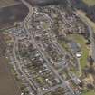 Oblique aerial view centred on the village (Main Street), taken from the E.