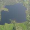 General oblique aerial view of Loch Mealt centred on Dun Grianan broch, taken from the N.