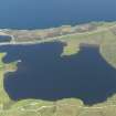 General oblique aerial view of Loch Mealt centred on Dun Grianan broch, taken from the WSW.