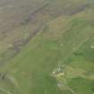 General oblique aerial view looking across Kilmuir and the Flora Macdonald monument, taken from the WNW.