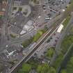 Oblique aerial view centred on the railway station, taken from the SW.