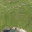 Oblique aerial view of the Broch of Underhoull and the field systems, looking E.