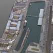 General oblique aerial view of the new development in Dundee harbour centred on the Victoria Docks, taken from the ENE.