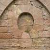 Detail of circular blocked opening inside arch
