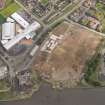 General oblique aerial view of Alloa, centred on former dock warehouse near Alloa Park, taken from the SW