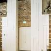 View doorway within Mackintosh furniture exhibition area in basement of school.