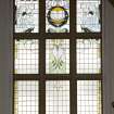 Interior. Main hall.  Balcony.  Detail of stained glass window on east wall.